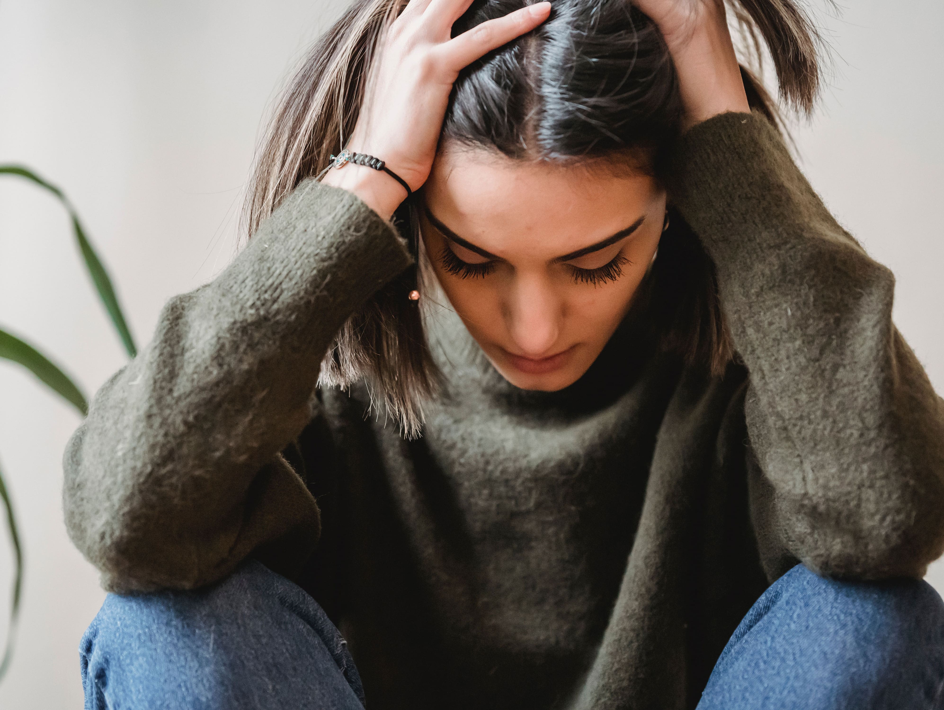 Image credits: https://www.pexels.com/photo/depressed-young-ethnic-lady-touching-head-and-looking-down-sitting-near-wall-6382648/
